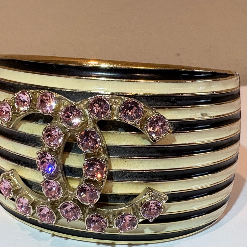 Authentic CHANEL cuff | Gold and Black stripes with Pink gem Accents